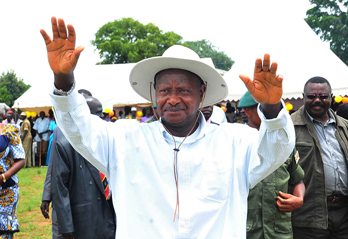 Museveni on arrival waving to people at the venue to officiate at prayers of 17th year of 1995 Atiaka massacre at Atiaka Primary School on 20/4/2012. PPU PHOTO