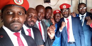 People Power Spokesperson Joel Ssenyonyi with People Power leader Bobi Wine, Hon Latif Ssebagala and others in a Police cell.