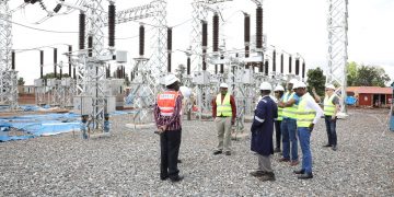 Umeme’s Selestino Babungi (in red shirt) with one of Umeme’s
Board Directors at the new and bigger Lira Integration Substation in readiness
for the upcoming 600 MW Karuma Hydro Power Station. As part of the
UGX310 billion, Umeme has allocated significant resources to evacuate and
distribute power from the in-construction Karuma and 16.5 MW Siti II
Hydroelectric Power stations.