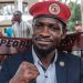 Ugandan opposition leader Robert Kyagulanyi, also known as Bobi Wine, poses for a photograph after his press conference at his home in Magere, Uganda, on January 26, 2021. - Ugandan soldiers have stood down their positions around the residence of opposition leader Bobi Wine, a day after a court ordered an end to the confinement of the presidential runner-up.
He had been under de-facto house arrest at his home outside the capital, Kampala, since he returned from voting on January 14, 2021.
For 11 days heavily armed soldiers and police officers surrounding the property had prevented members of Wine's household, including his wife, Barbie, from leaving their compound and denied access to visitors. (Photo by SUMY SADURNI / AFP)