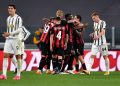 TURIN, ITALY - MAY 09: Ante Rebic of A.C. Milan (hidden) celebrates with team mates after scoring their side's second goal during the Serie A match between Juventus  and AC Milan at  on May 09, 2021 in Turin, Italy. Sporting stadiums around Italy remain under strict restrictions due to the Coronavirus Pandemic as Government social distancing laws prohibit fans inside venues resulting in games being played behind closed doors. (Photo by Valerio Pennicino/Getty Images)